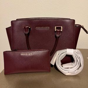Maroon Michael Kors handbag with detachable strap. Including 6 card slot wallet